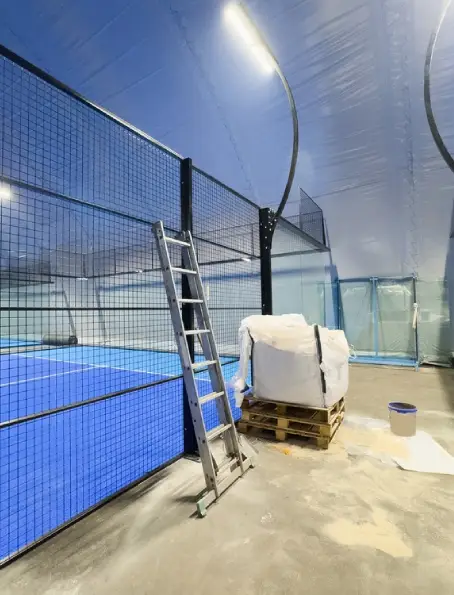 Industrial fence and gates installation with secure perimeter fencing and equipment inside facility